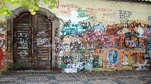 Click a picture at the Lennon Wall 